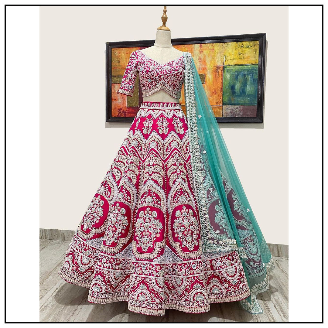 Rani pink tapeta silk heavy embroidered bridal lehenga choli